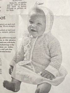 Photo of baby in knitted jacket, Stitchcraft, October 1965.